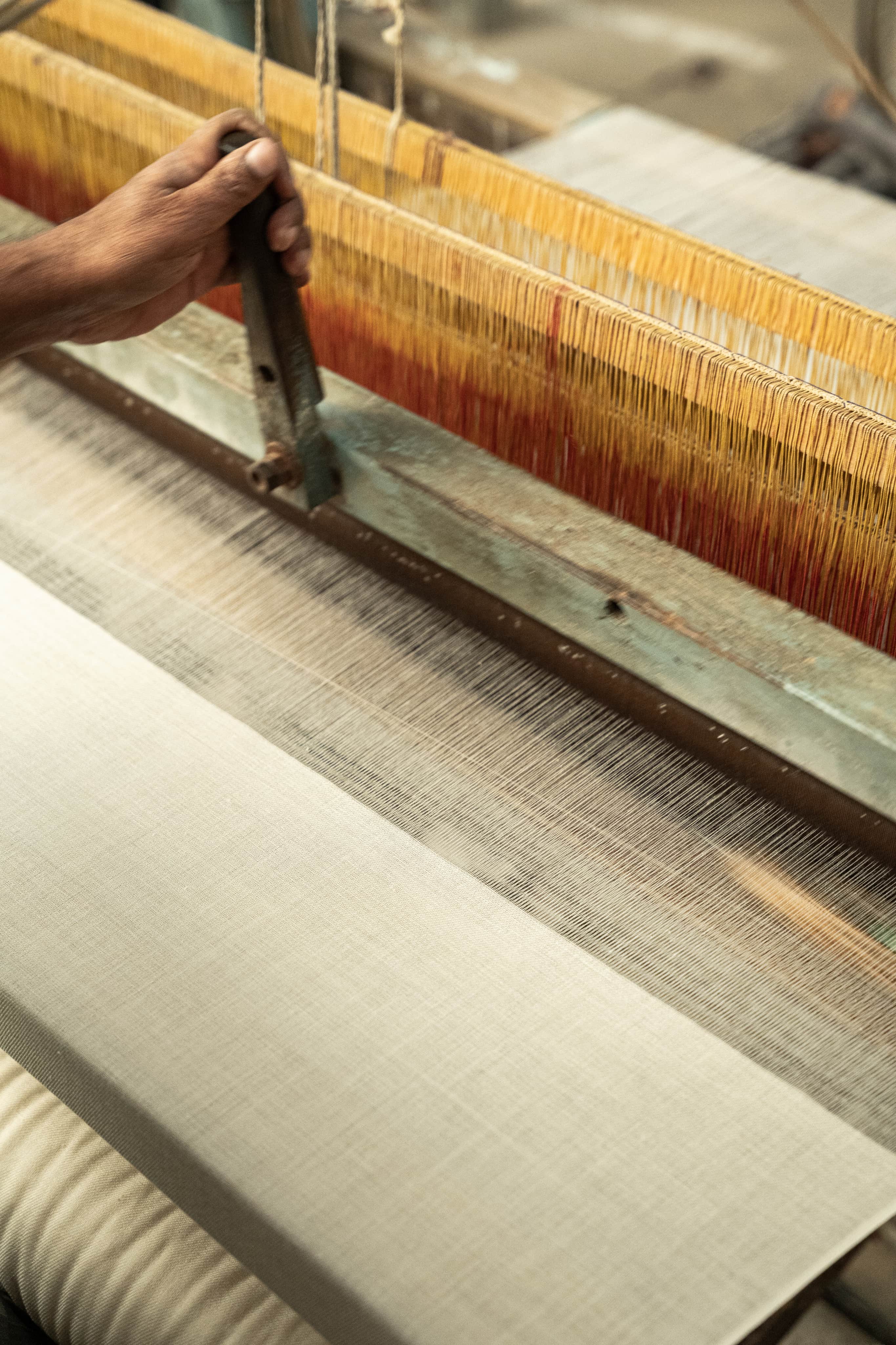 Artisan working on a traditional cashmere loom